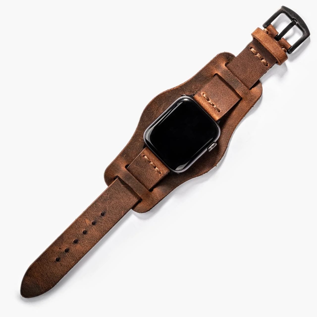 Bund Tek Katlı Apple Watch Deri Kayış, saat üzerinde masa üstünde sergileniyor