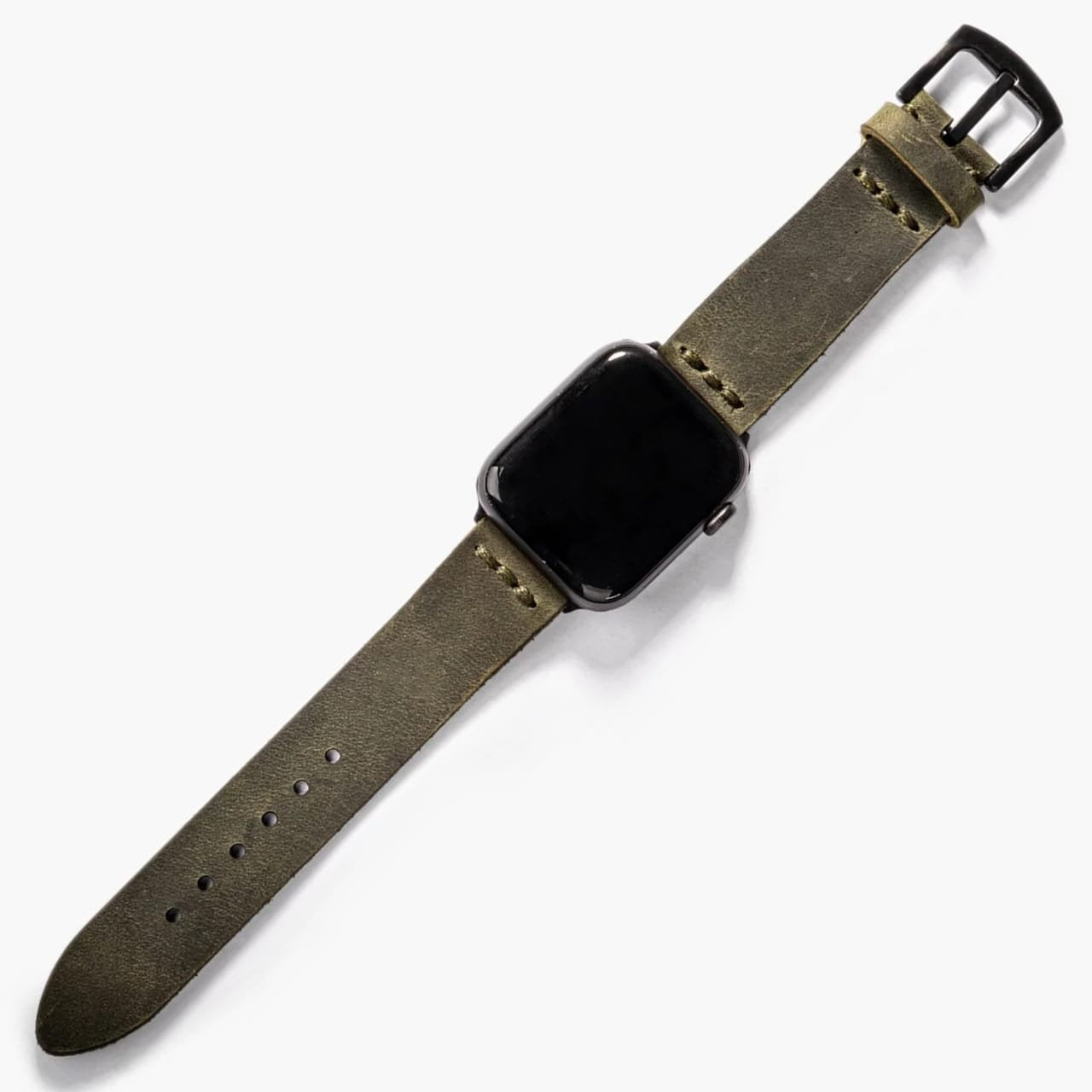 Tek Katlı Deri Apple Watch Kayışı – Yeşil, masa üzerinde açık şekilde sergileniyor